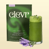 Clevr Honey Lavender Matcha SuperLatte bag with a glass of matcha and lavender flowers on a beige background