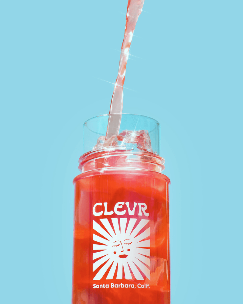 Strawberry Lemonade SuperTea pouring into a Clevr Shaker Bottle.
