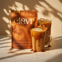 Clevr salted caramel chai superfood package with two glasses of iced chai on a textured surface.
