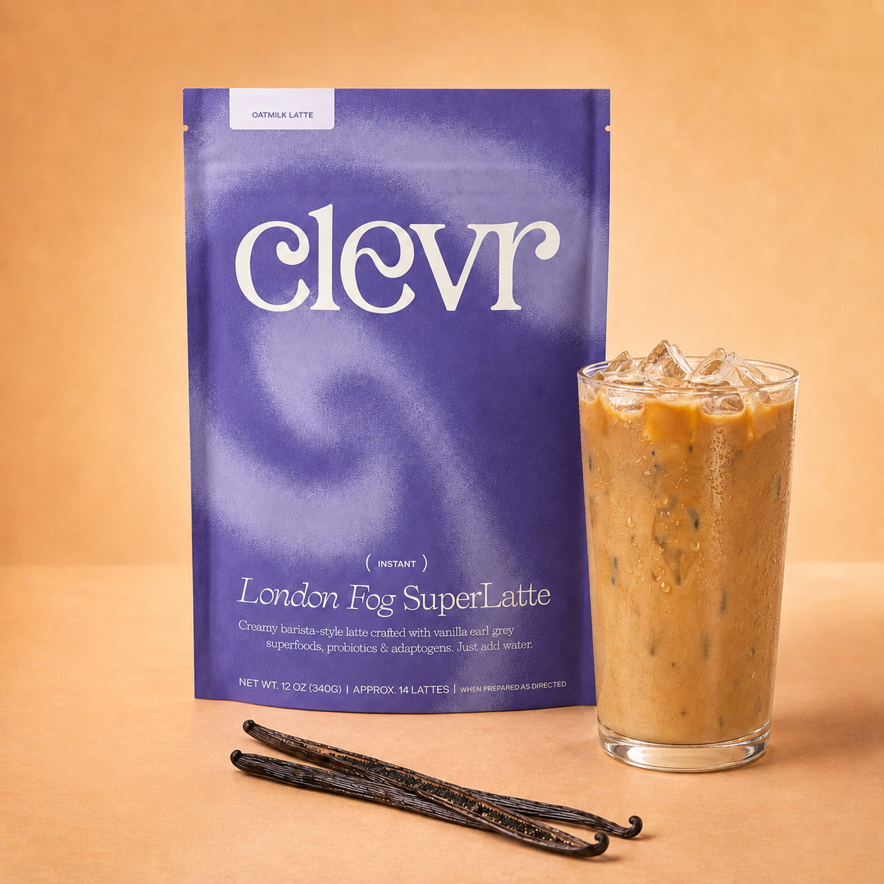 A package of Clevr Instant London Fog SuperLatte stands next to a glass of iced coffee with vanilla beans on a warm beige background.