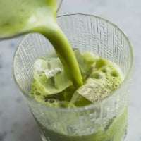 video of matcha pouring into glass